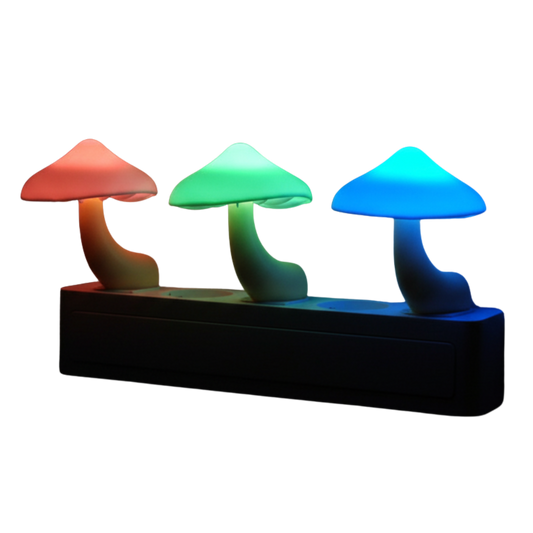 Three colorful LumiShroom mushroom-shaped lights on a black base against a white background