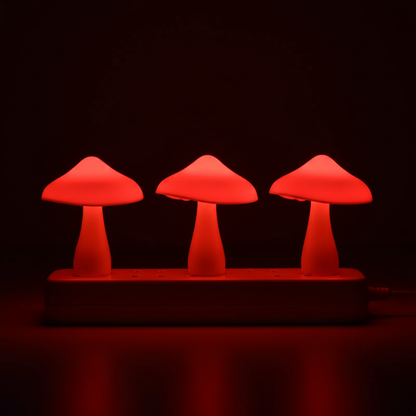 LumiShroom Mushroom-shaped night light  lamps emitting a red glow in a dark setting
