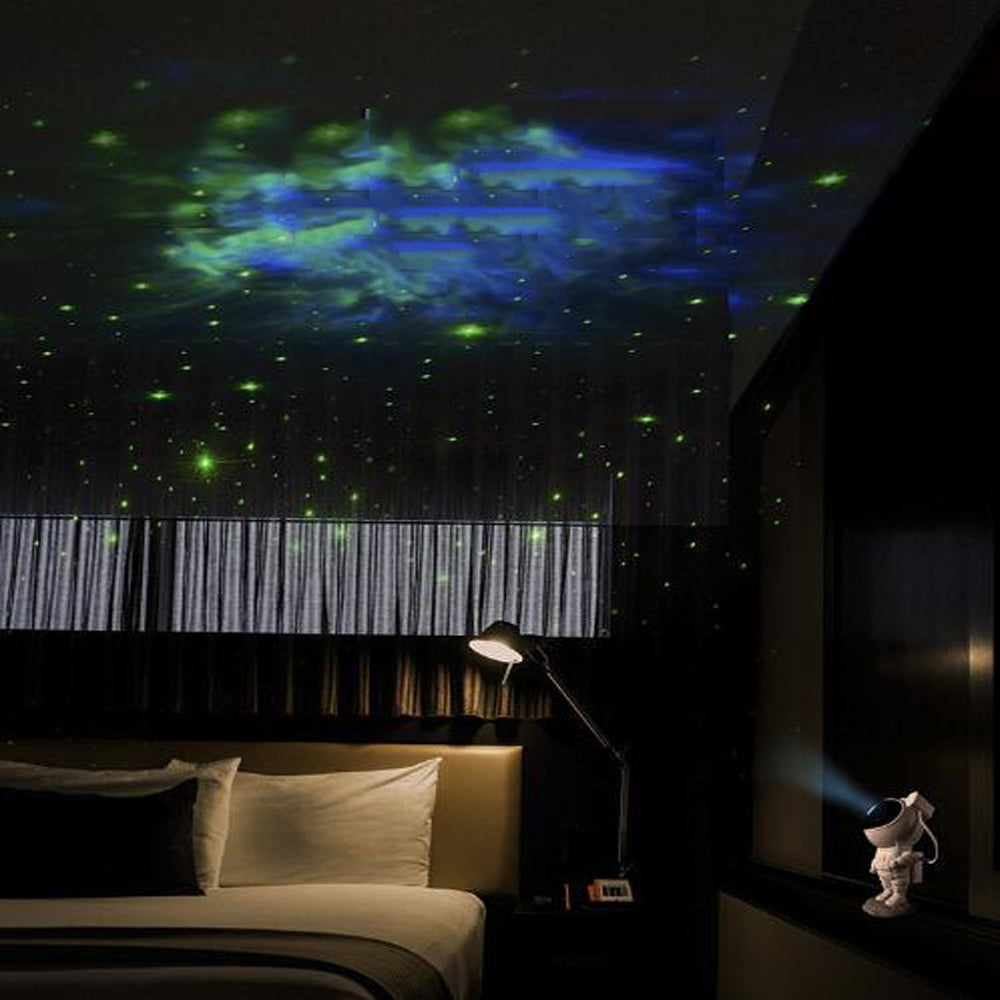 SpaceBuddy Astronaut Galaxy Projector, room with a starry night sky projection on the ceiling, creating a cozy atmosphere.